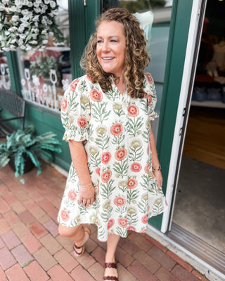 a fall floral a line style dress with a puff style sleeve
