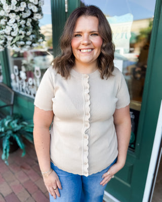 a short sleeve button down cardigan sweater with scalloped detail