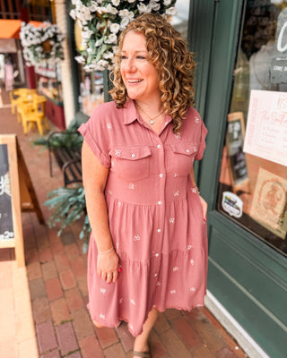 a rose colored linen button down tiered embroidered bow dress with front flap chest pockets