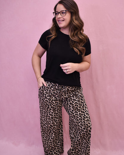 Leopard print drawstring wide leg pants paired with a basic black top