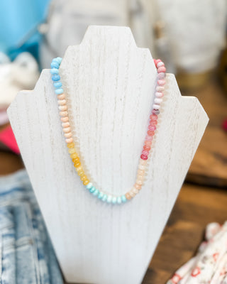 a light colored small bead necklace