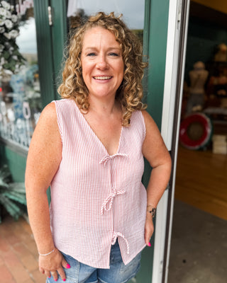 a sleeveless striped bow tie top