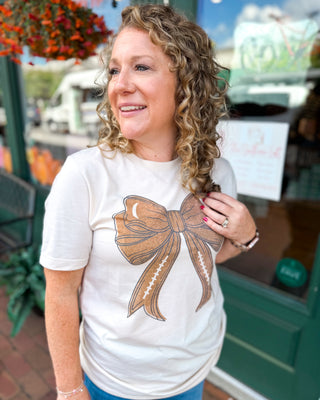 Gameday Football Bow Graphic Tee - a sublimation graphic of a bow with football design