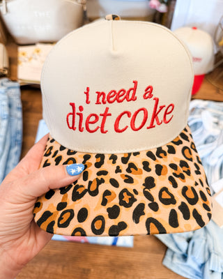 a leopard canvas hat that says i need a diet coke