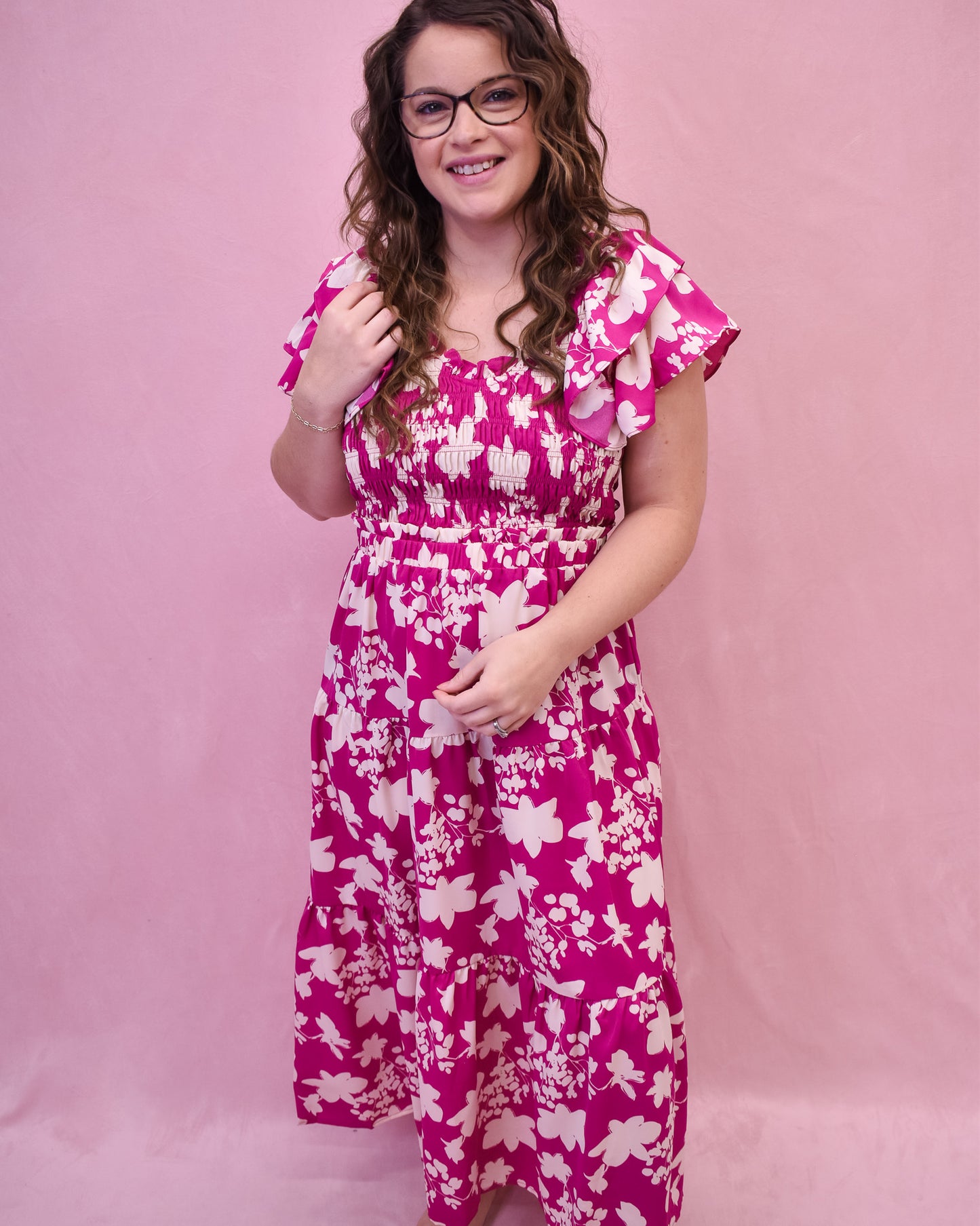 Ruffle sleeve midi dress with floral details in white, and ruching across the bust.