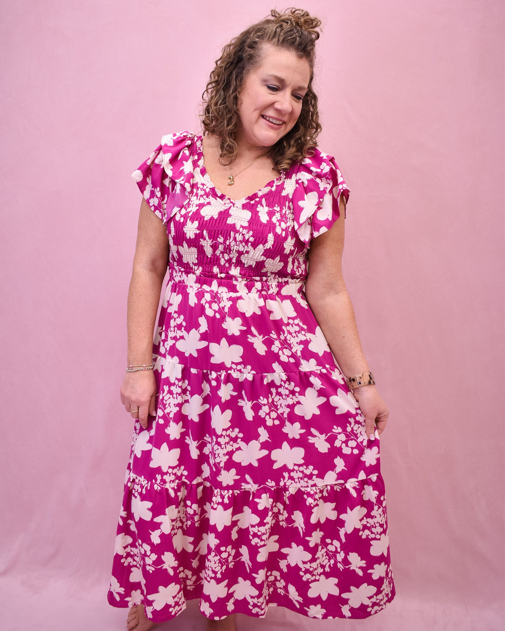 Pink flutter sleeve style midi dress with ruching.