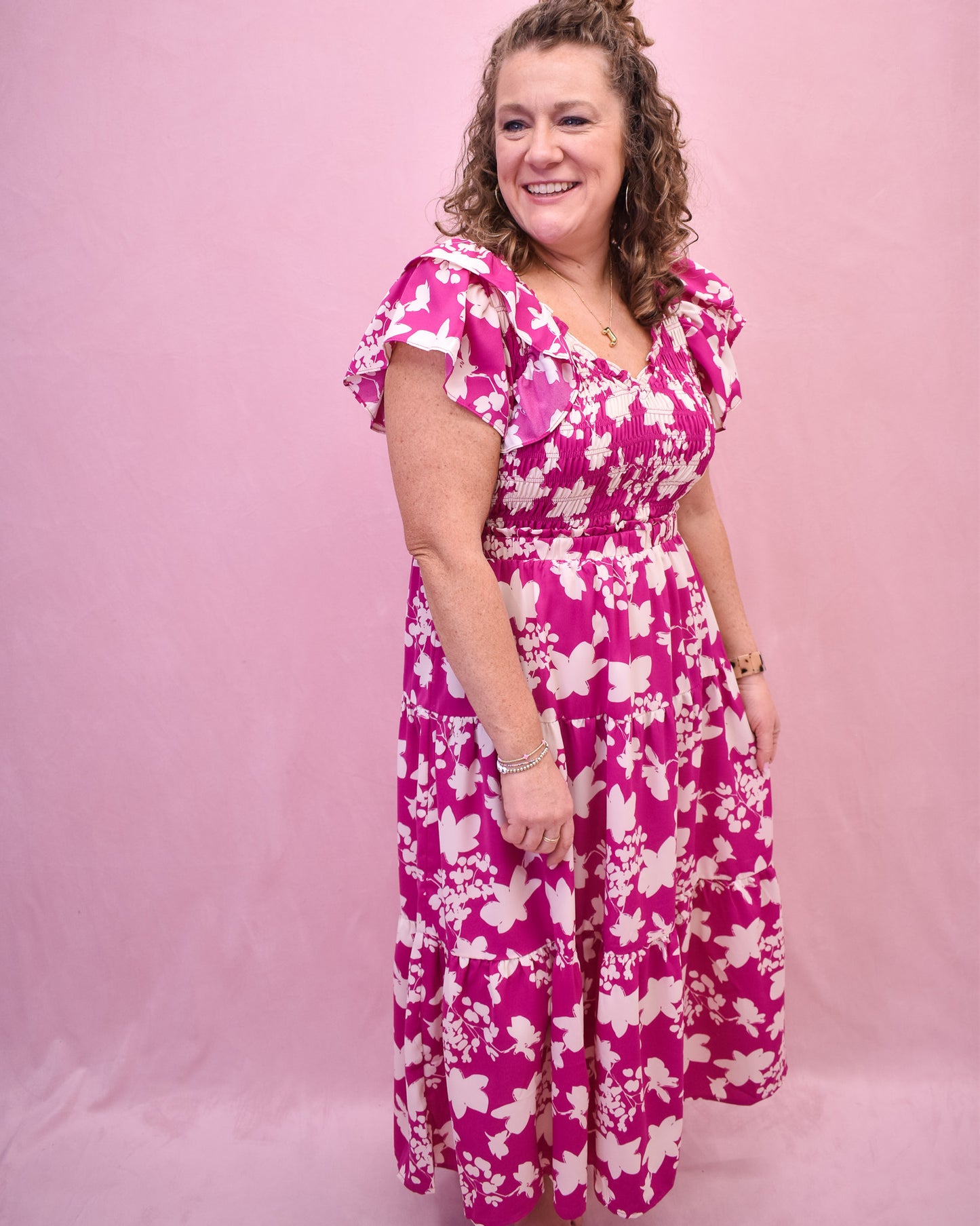 Pink flutter sleeve style midi dress with ruching.