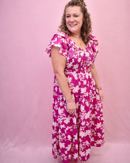 Pink flutter sleeve style midi dress with ruching.