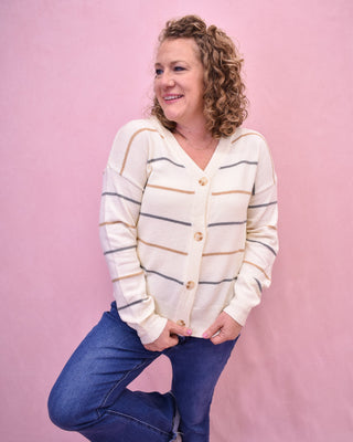 a long sleeve button down cardigan with blue and brown stripes