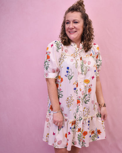 Floral Watercolor design drop hem dress in cream.