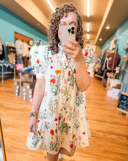 Floral Watercolor Button Down Dress for Spring. Knee length, drop style hem with details.