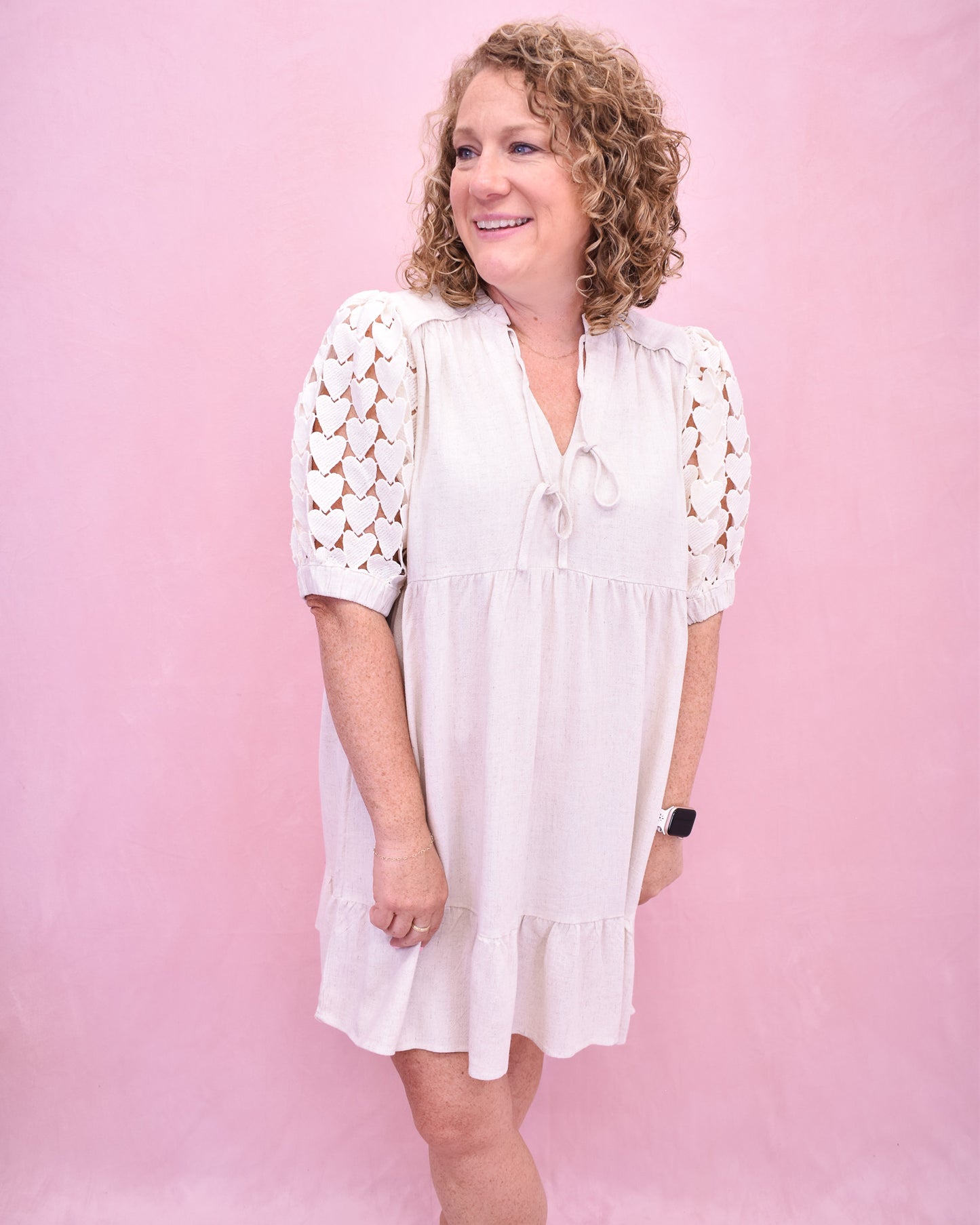Tiered linen style dress with heart crochet puff sleeves.