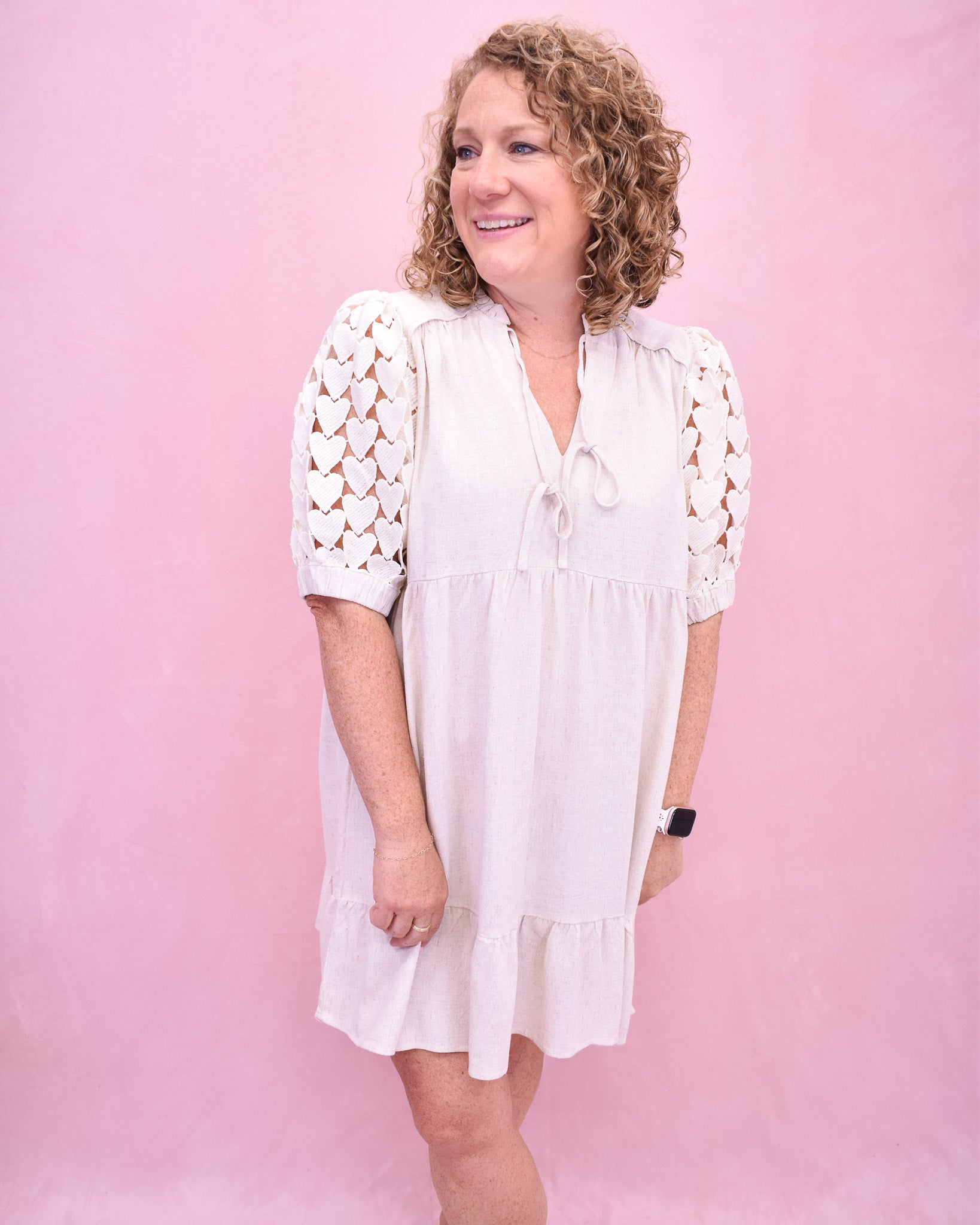 Tiered linen style dress with heart crochet puff sleeves.