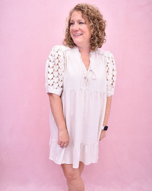 Tiered linen style dress with heart crochet puff sleeves.