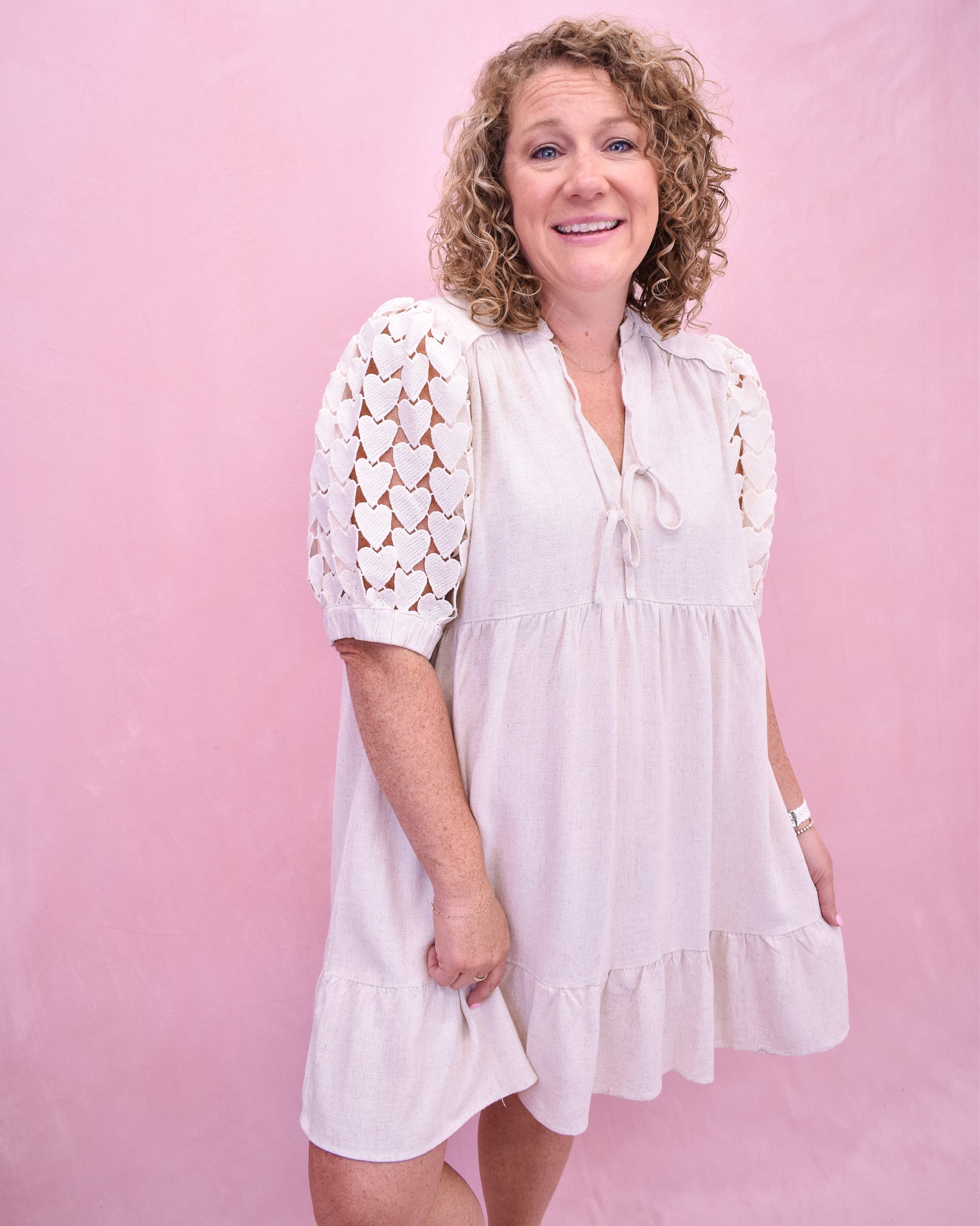 Tiered linen style dress with heart crochet puff sleeves.