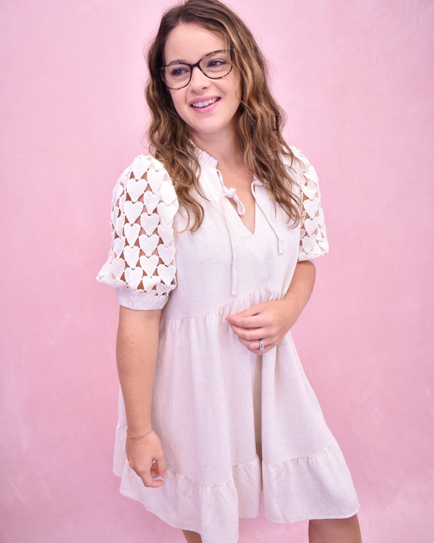 Tiered linen style dress with heart crochet puff sleeves.