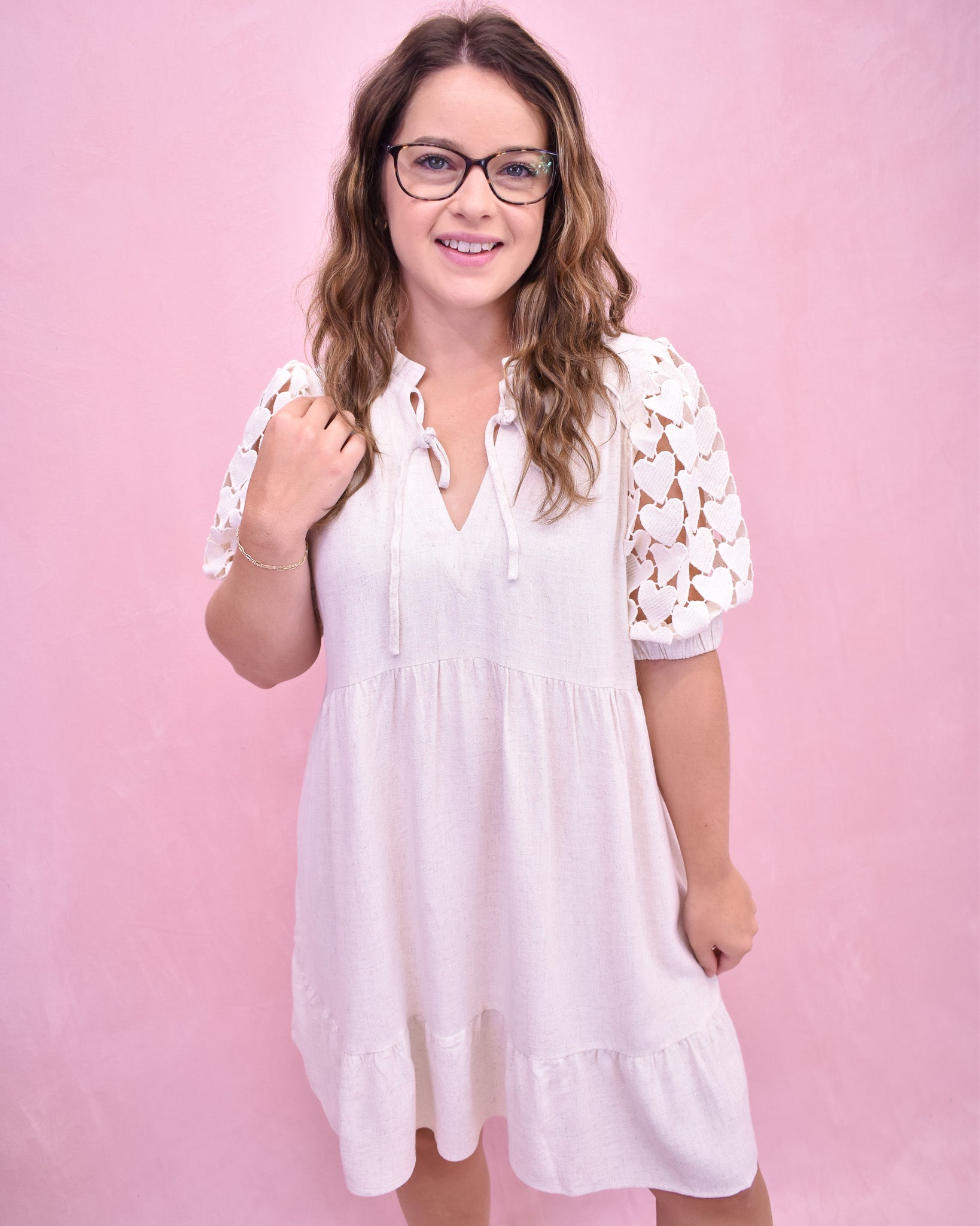 Tiered linen style dress with heart crochet puff sleeves.