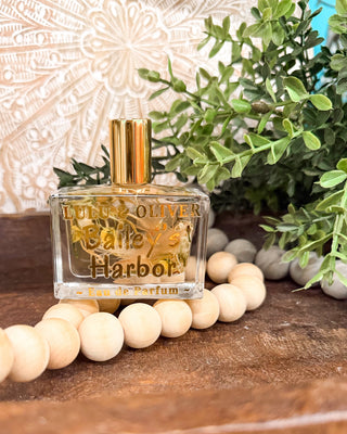 Lulu + Oliver Women's Fragrance Bottle filled with floral pieces