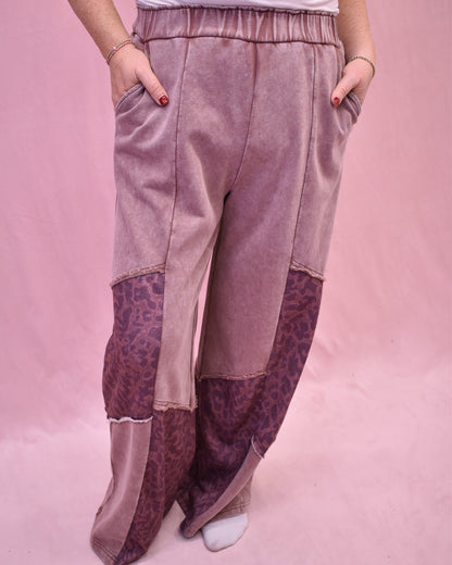 Patchwork pants with leopard print on a pink background