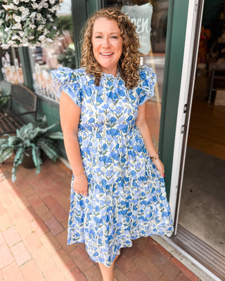 a blue and light blue floral midi dress with ruffle cap sleeves