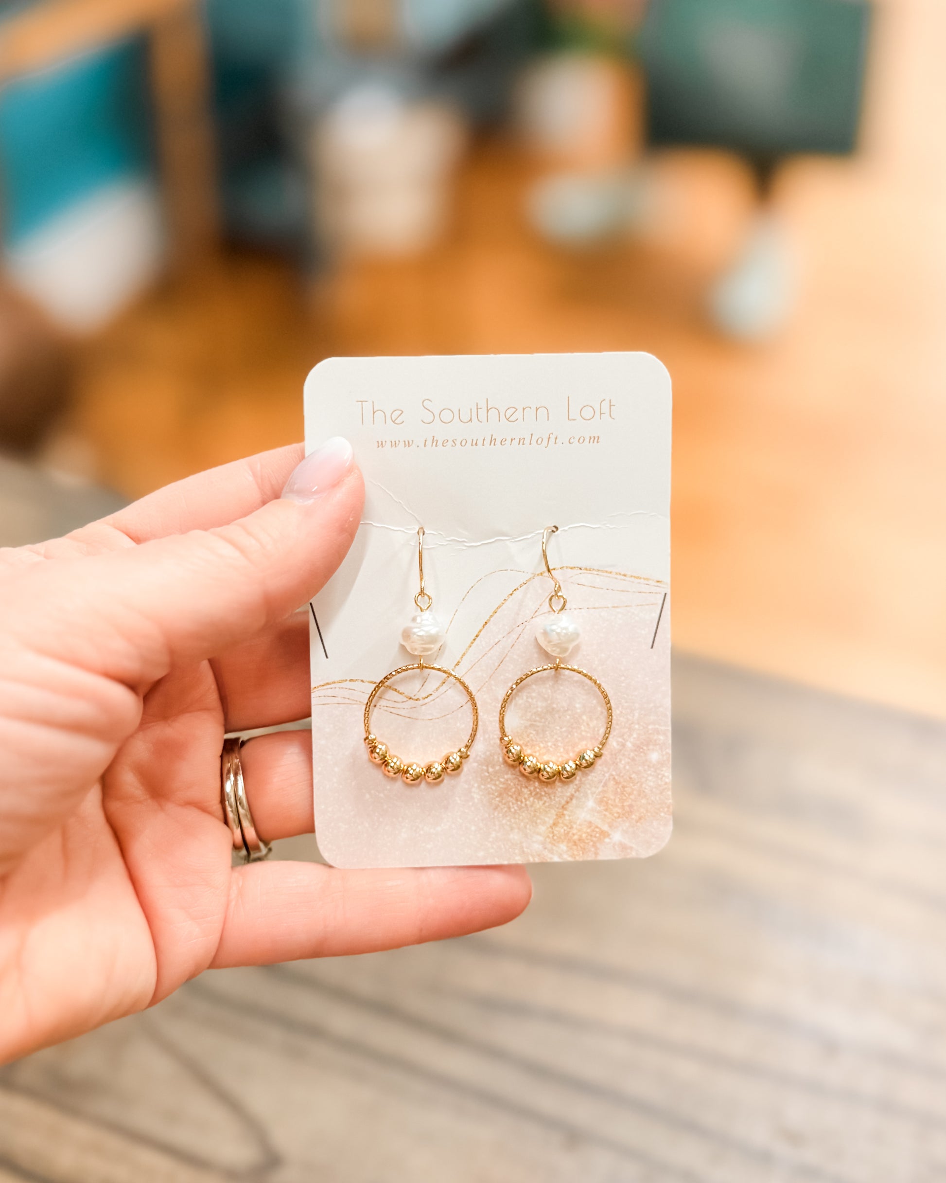 gold drop earrings with pearl accents