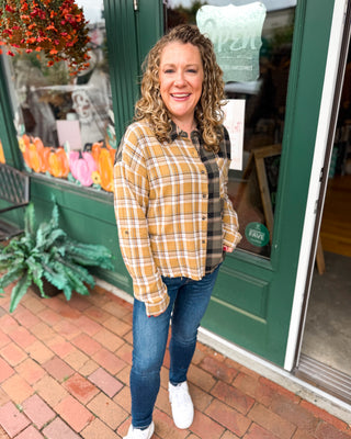 Perfectly Undone Mixed Print Plaid Distressed Top A long sleeve button down mixed print plaid top.
