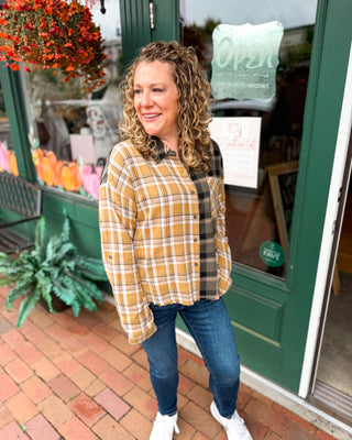 Perfectly Undone Mixed Print Plaid Distressed Top A long sleeve button down mixed print plaid top.