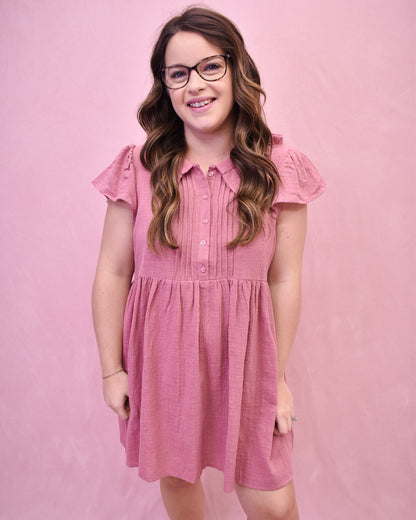 a mauve linen mini dress with front pleated style and collar.