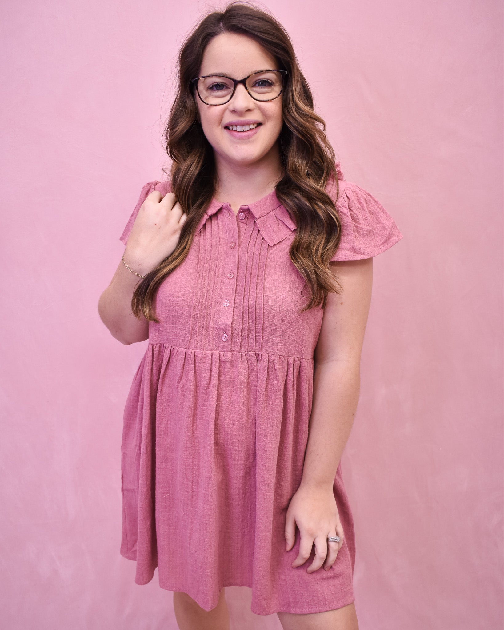 a mauve linen mini dress with front pleated style and collar. 