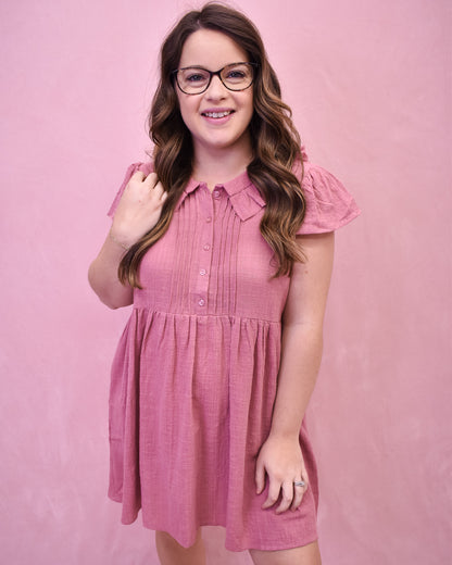 a mauve linen mini dress with front pleated style and collar. 