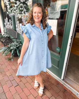 a button down denim mini dress with ruffle cap sleeves