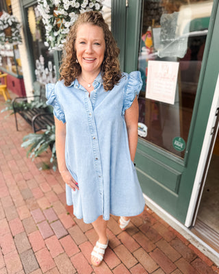 a button down denim mini dress with ruffle cap sleeves