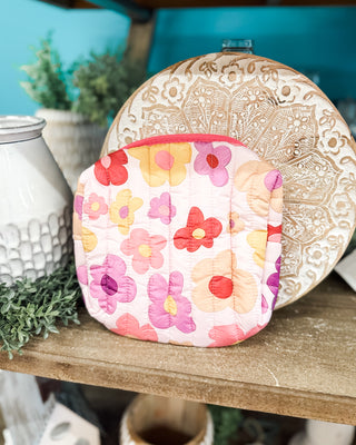 a daisy zip up cosmetic bag