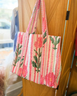 a striped pink and floral tote bag