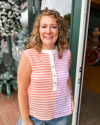 a striped color block sleeveless top with button down front