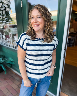 a short sleeve crochet navy striped sweater with scalloped details