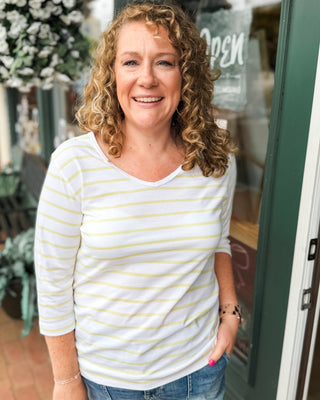 a vneck yellow striped 3/4 sleeve top