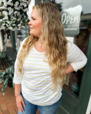 a vneck yellow striped 3/4 sleeve top