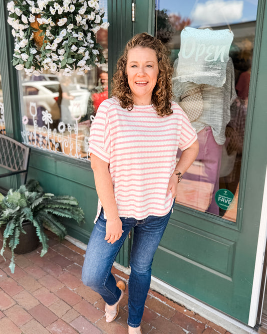 A pink short sleeve striped textured top 