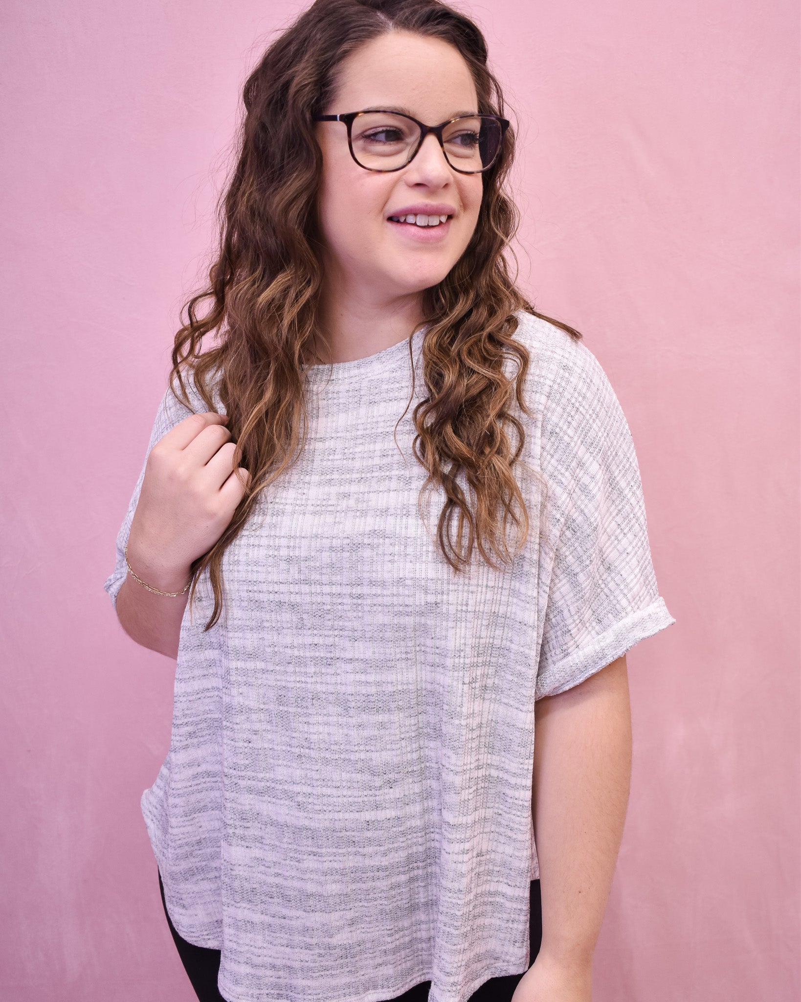 lightweight heathered gray top with a short sleeve and batwing style