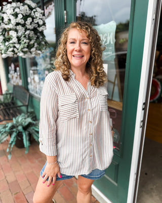 a long sleeve striped button down casual top