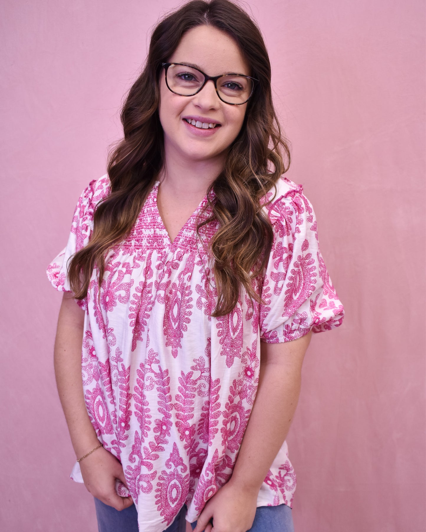 White short sleeve top with pink embordered details