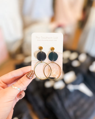 a drop post hoop earring with black disk detail