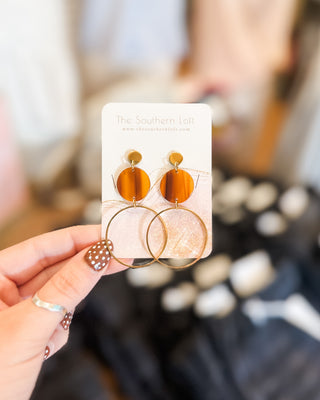 a drop post hoop earring with walnut disk detail