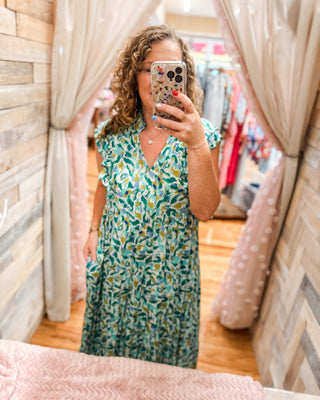 a tropical tiered midi dress
