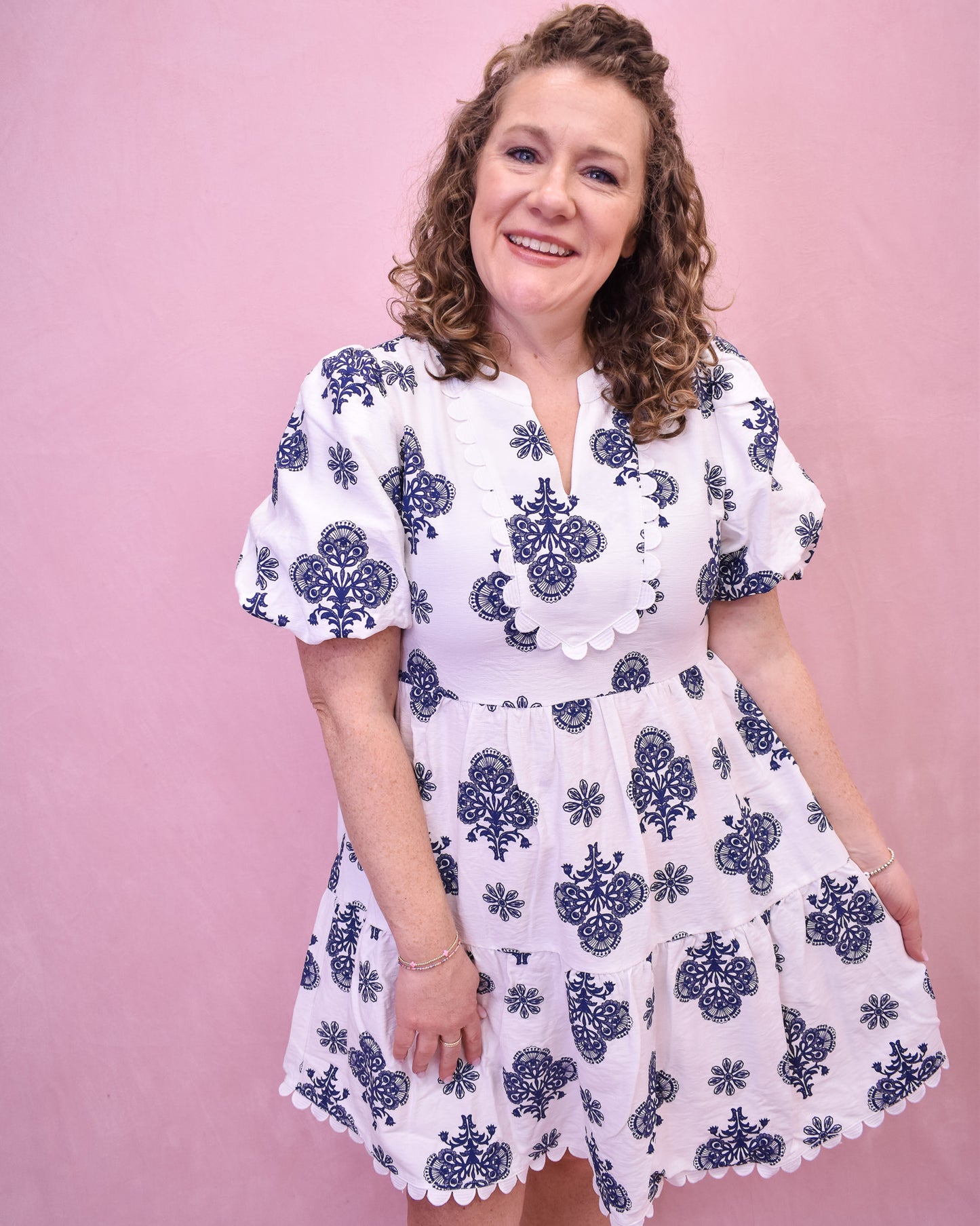 White mini dress with navy floral embroidered details