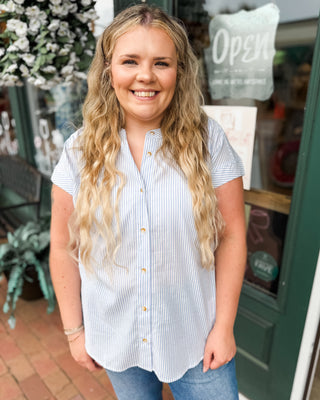 a short cap sleeve stiped button down top in light blue