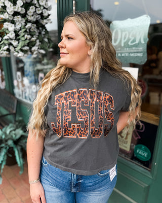 a black crop baby tee with JESUS leopard print graphic