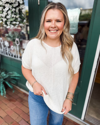 a short sleeve knit sweater by zenana in the color cream
