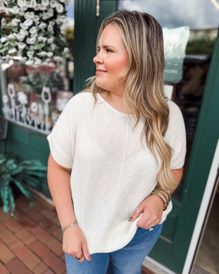 a short sleeve knit sweater by zenana in the color cream